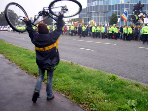 bike crew cheer on the kettled kids march in through the rain