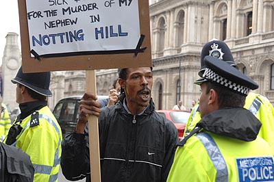 Bereaved reletives don't like being told where to stand.