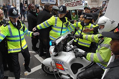 More Police have to retrieve him from the angry protesters.