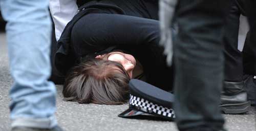 Woman dragged out and knocked down