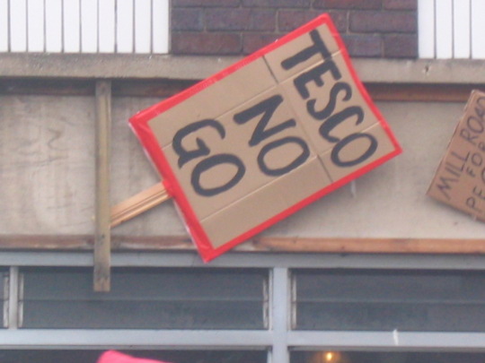 Banners attached to the proposed Tesco buildign at the end of the march