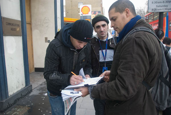 People stop and sign the petition