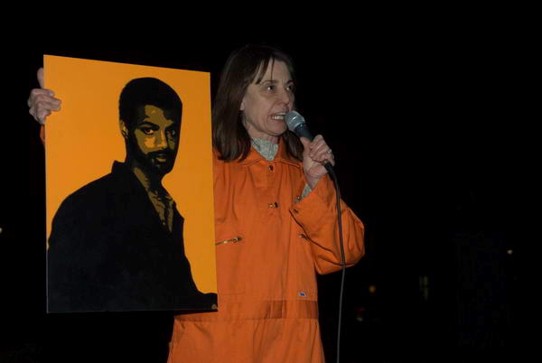 Jackie Chase holds a picture of Binyam Mohamed