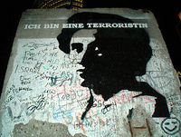 Rosa Luxemburg on the Berlin wall. Writing says: "I am a terrorist"