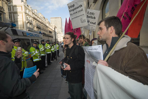 Police kept press and protestors at the back of the pavement