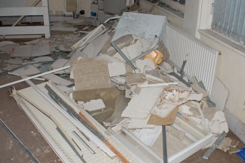 Ground floor piled high with trashed materials