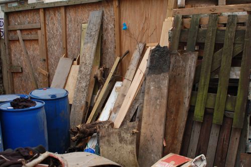 Previously a fly tip, resources in the yard are now sorted for reuse