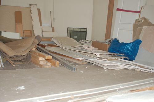 Plasterboard and timber awaiting reuse as renovation continues