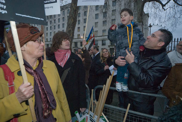A young man leads the chanting