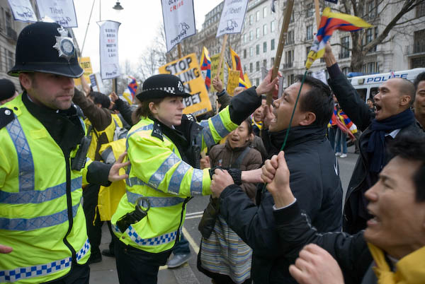 Police push protesters back