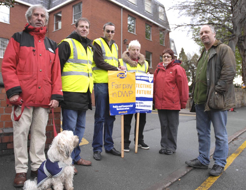 Six striking workers and a dog