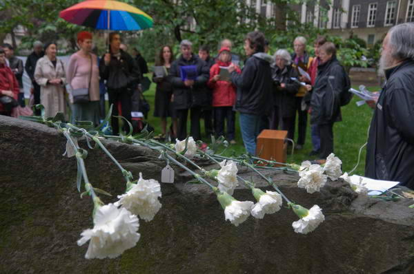 White carnations representing COs from countries around the world