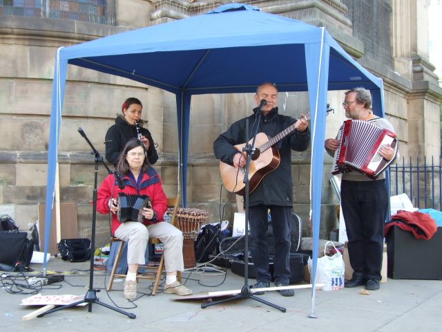 Banner Theatre playing some songs about migrants and resistance