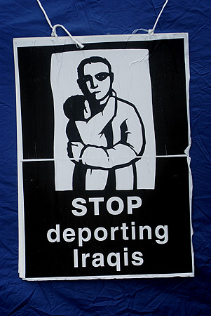 A poster hangs from one of the tents.