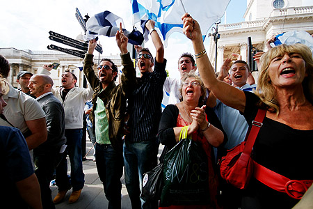 Pro-Israeli supporters taunting Palestinians.