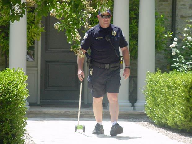 Law enforcement measuring the 50 foot mark