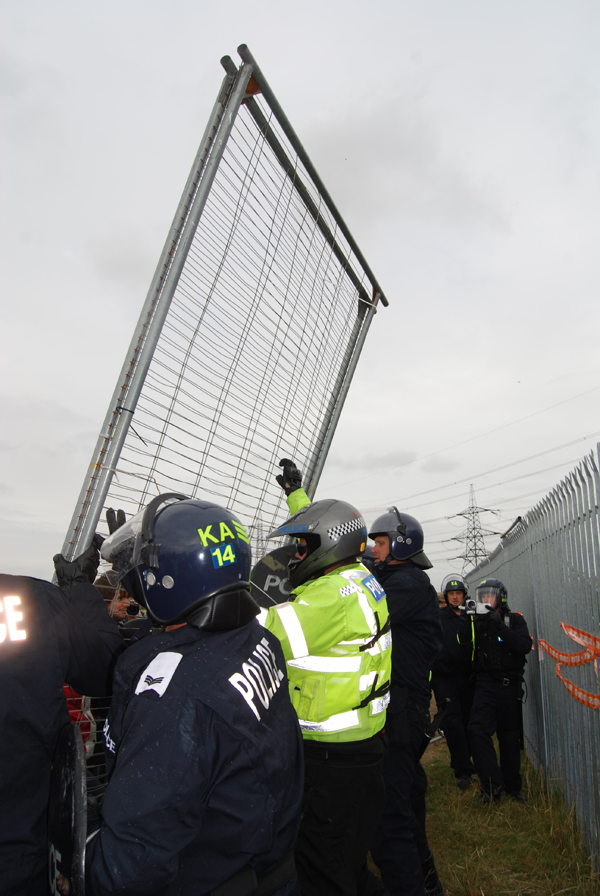 cops dismantle powerstation fence!