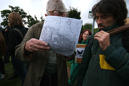 The activists examine police literature.