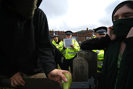 A police officer reads from the document.