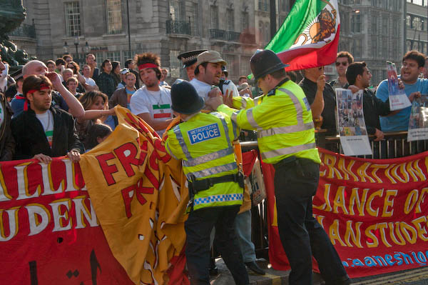 Police grab Iranian demonstrator who tried to climb barrier