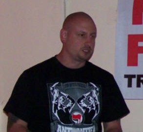 Wigan Mike strains to drag his knuckles from the floor