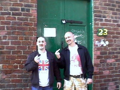 White poses outside 'The Common Place' with another moron 'Wigan Mike'