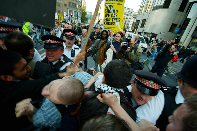 Police and the crowd clash in the City.