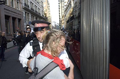 Cop, protester, bendy bus.