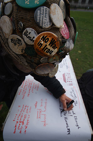 Brian Haw signs the petition.