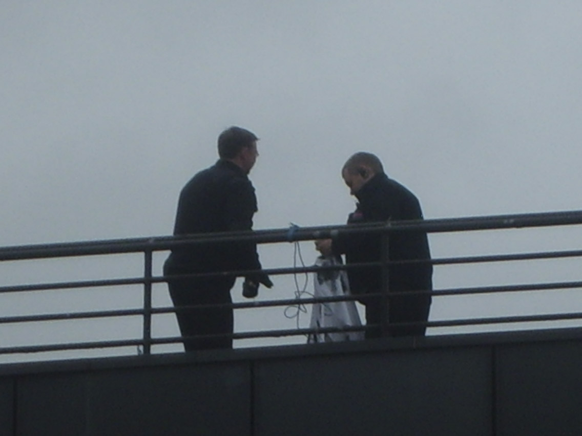 University security taking down banner