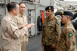 Ahmed Shuja Pasha, Ashfaq Kayani and Michael Mullen on the USS Abraham Lincoln.
