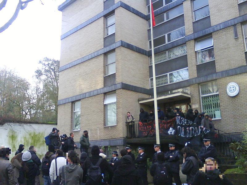 Greek embassy, red-black flag rising
