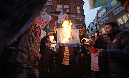 The Israeli flag is burned.
