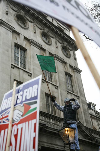 The march has arrived at the Israeli Embassy, - heavily protected by the MET