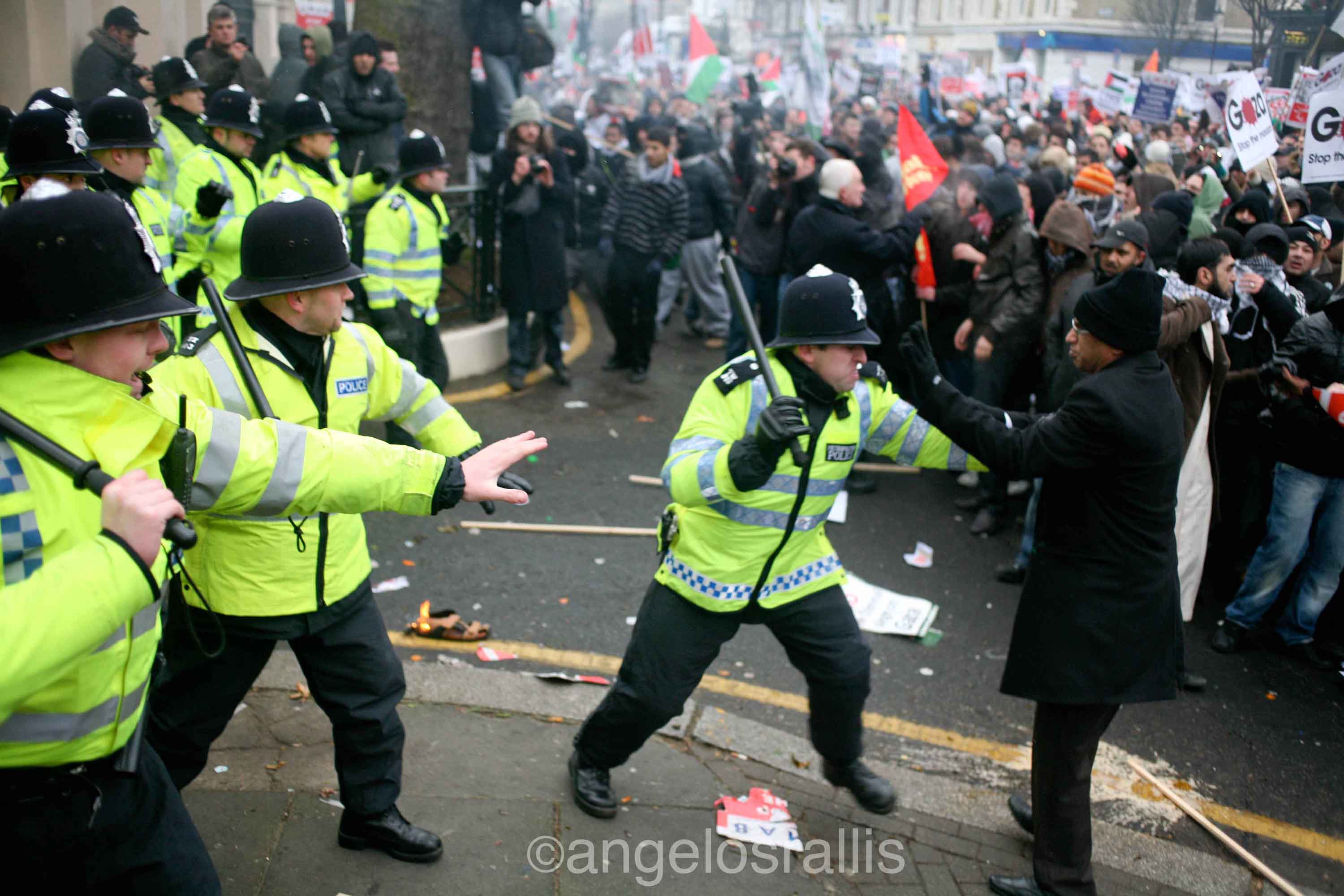 Elder protester being attacked by erratic police officer