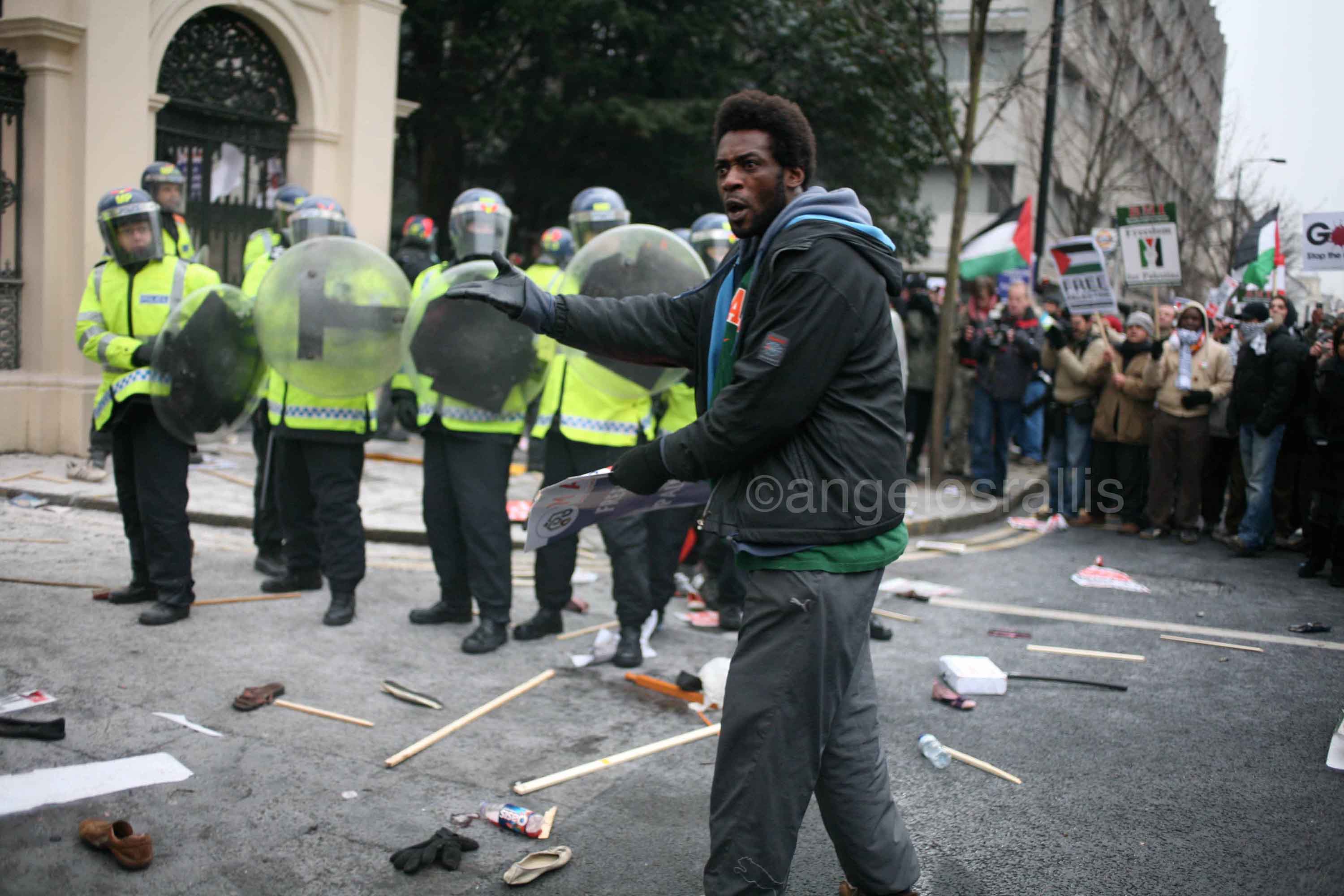 Protester in shock unable to explain the presence of anti-riot officers.