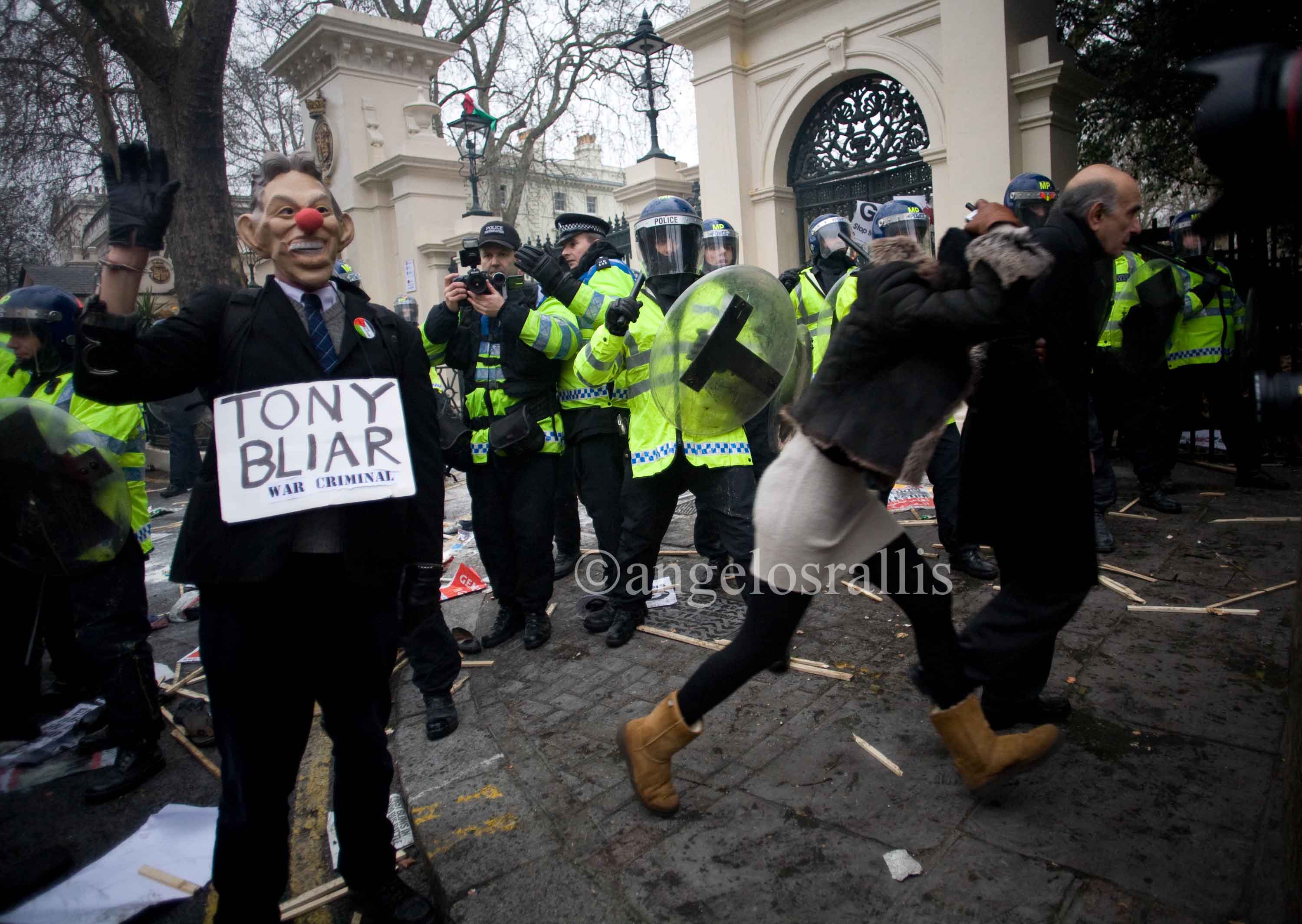 Officer using flash photography to record protesters