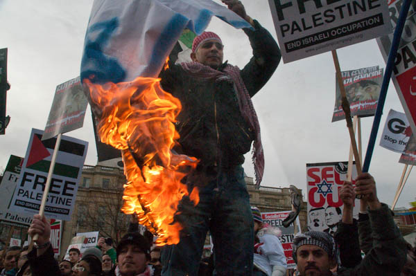 A flag goes up in flames