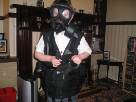 Kid in riot gear