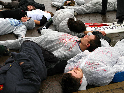 Students die-in to highlight death threats to workers