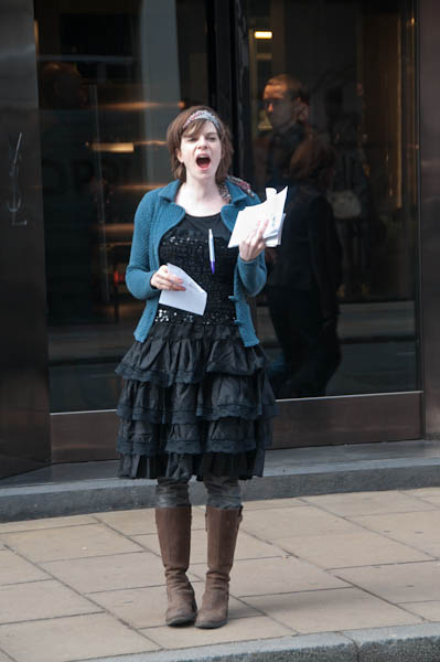 A man watches from inside Yve St Laurent opposite