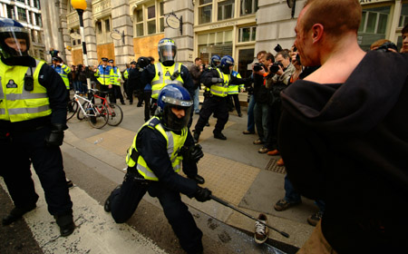 ...and is then batoned across the legs.