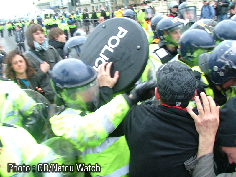 Coppers using shield as a weapon.