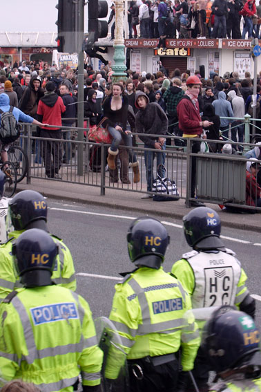 Police march past pier