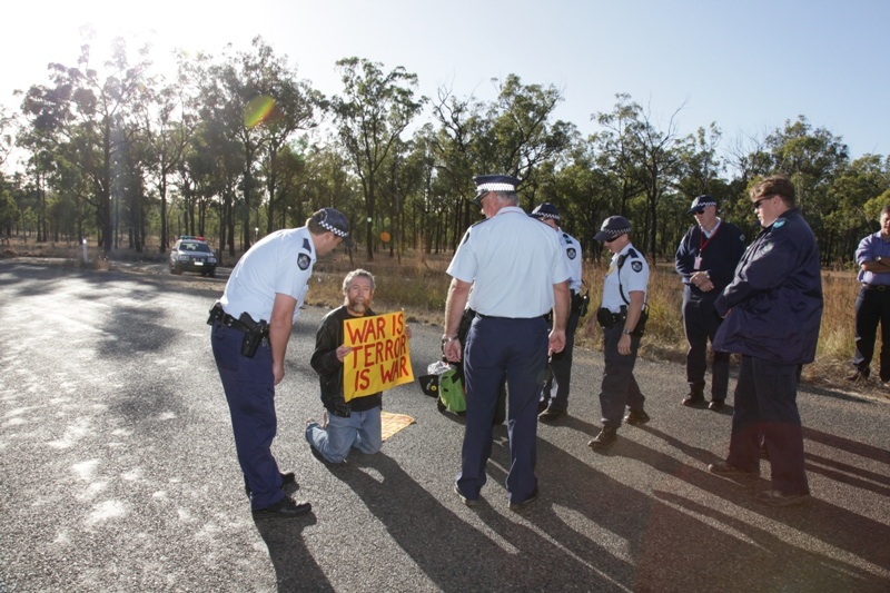 Police arresting Jim Dowling for blocking military access to the Talisman Sabre
