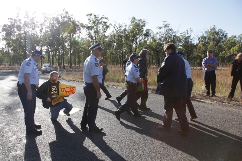Police arresting Anti-War activists Jim Dowling and Ciaron O’ Reilly for blockin