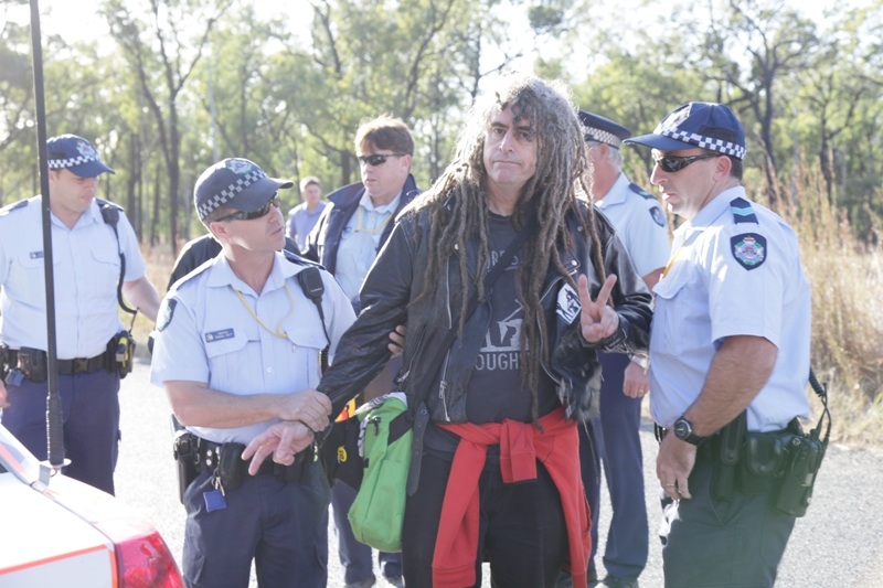 Police arrest Ciaron O’ Reilly for blocking military access to the Talisman Sabr