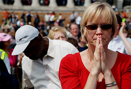 A woman prays.