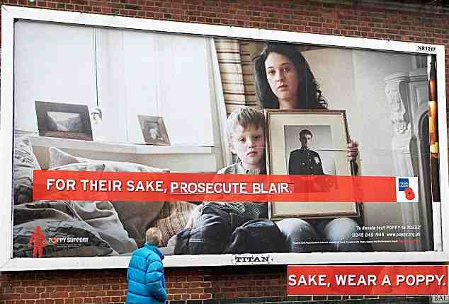 Defaced: One of the posters changed by anti-war vandals and, inset, the official