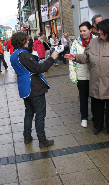 Campaigner posing as Boots staff, handing out "Dis-advantage Cards"
